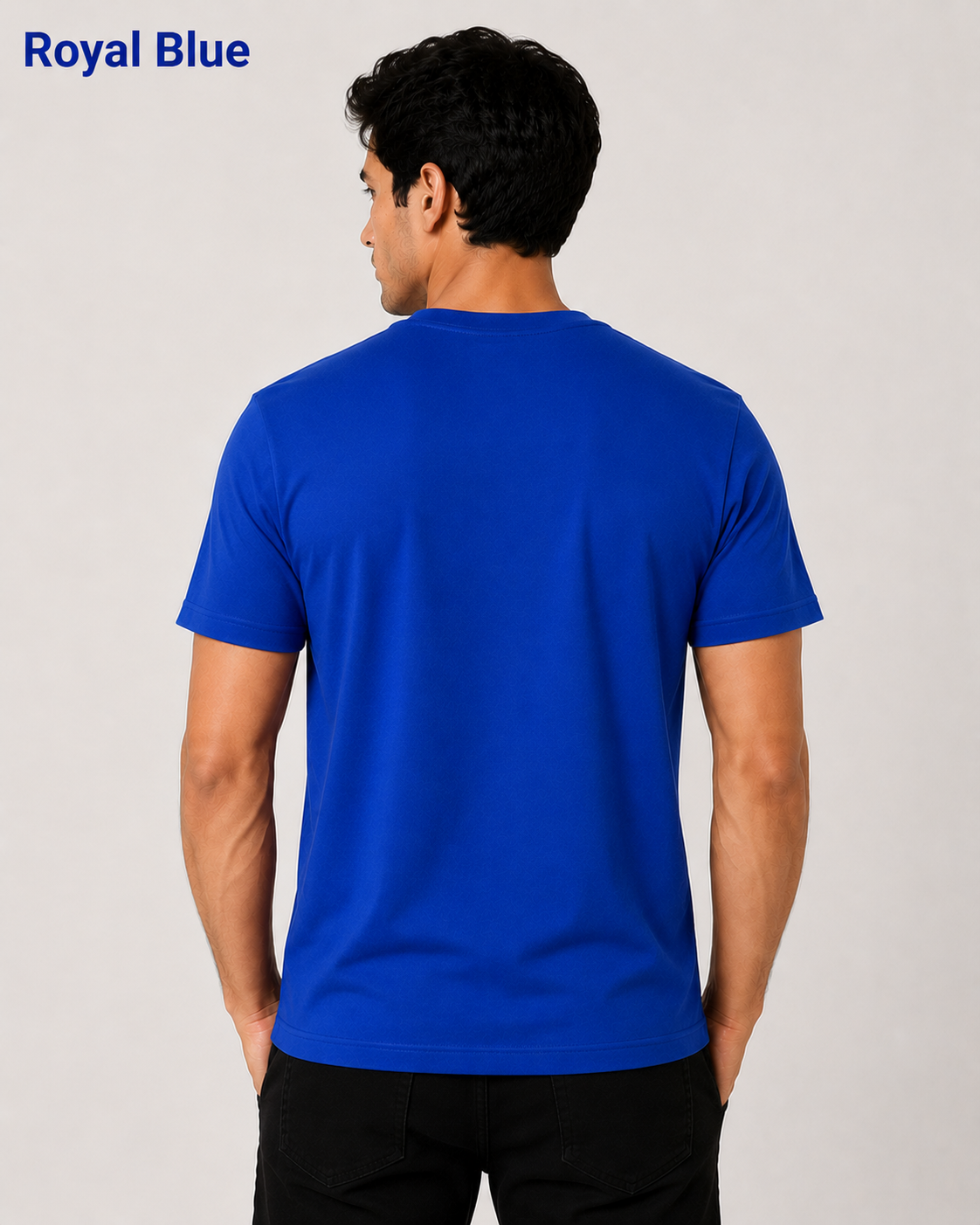 Man wearing a blue t-shirt on a plain background